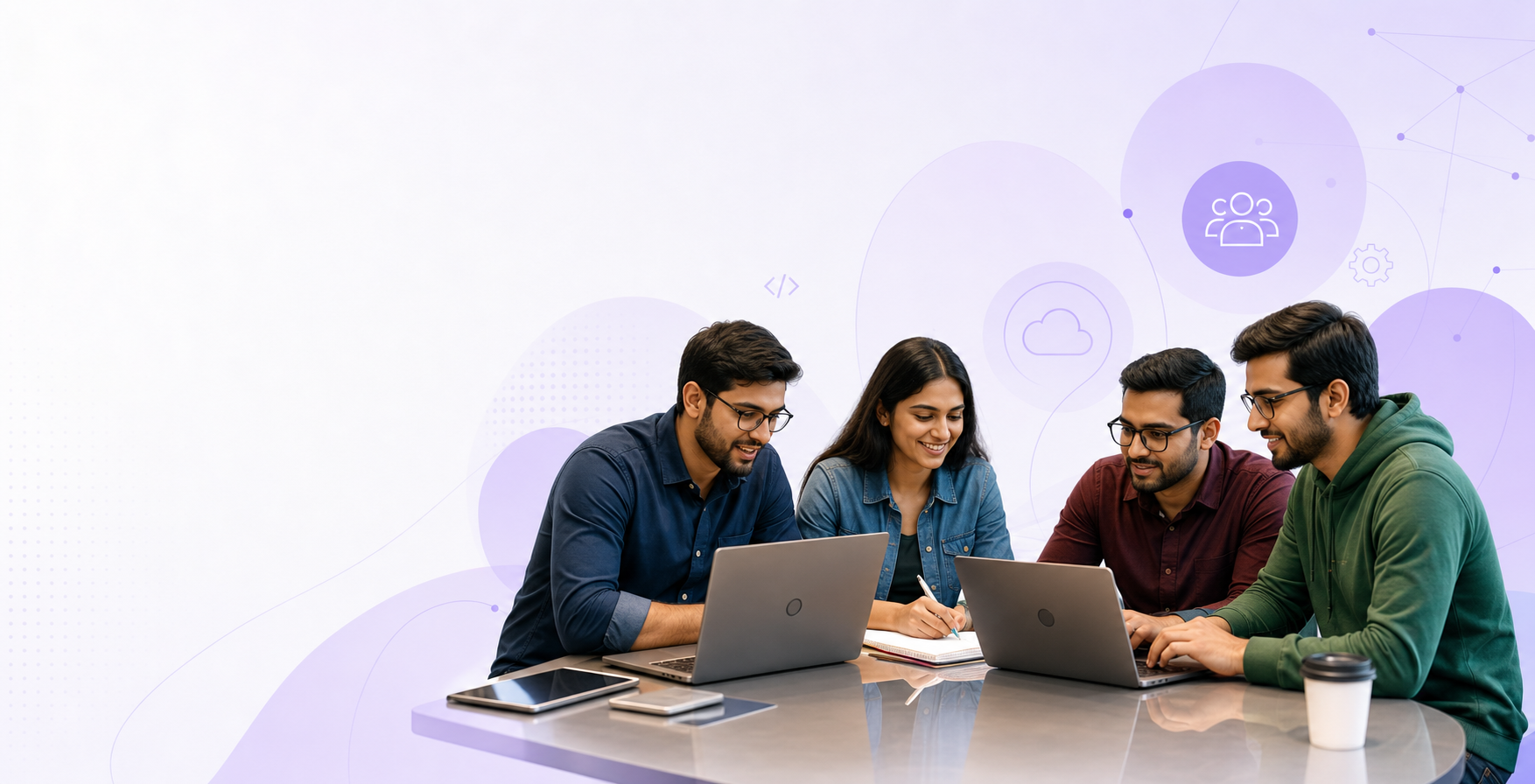 Developers collaborating around laptops